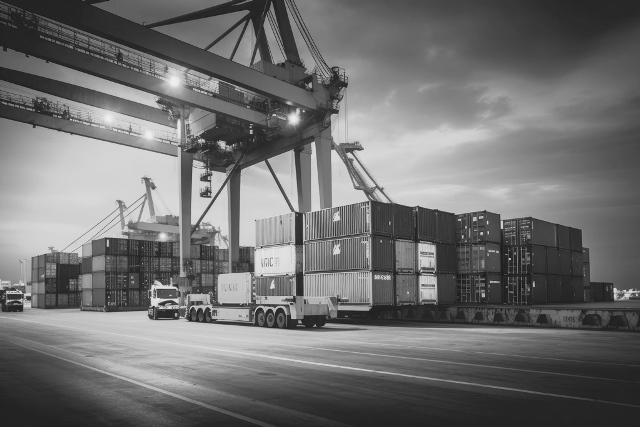 logistics-transportation-container-cargo-ship-cargo-plane-with-working-crane-bridge-shipyard-sunrise-logistic-import-export-transport-industry-background-ai-generative